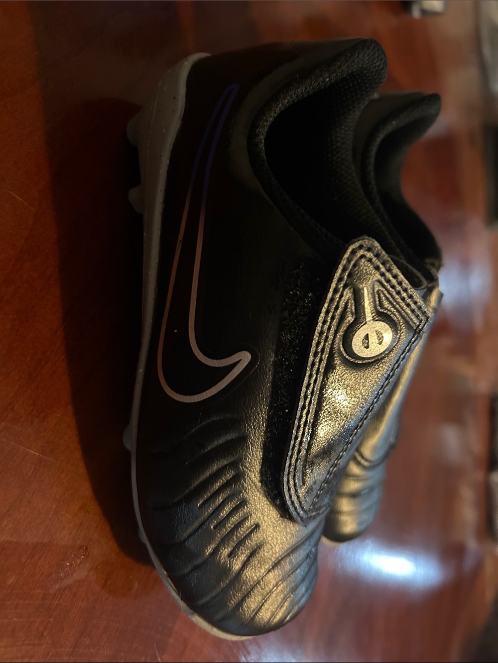 Nike Kids Black Soccer Sneakers with Purple Accent Swoosh